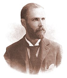 Photograph of a middle-aged man with a beard and moustache, wearing a coat and tie. The signature "Charles H. Kerr" appears beneath the photo.