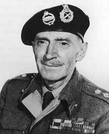 Black-and-white photograph of a middle-aged man dressed in British Army uniform