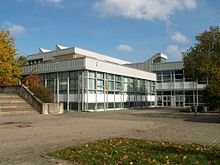 A square building with large windows.