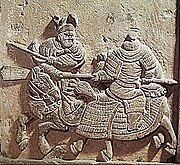 Relief of a Jin rider facing off against a Song cavalryman