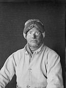 Monochrome portrait photograph of Apsley Cherry-Garrard in artic explorer's woollen clothing with sunburnt nose and goggle-marks