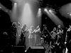 A black and white photo of The Black Crowes onstage