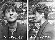 "Small black and white profile photograph of O'Malley, with the letters "B Stuart" written by hand across the bottom, taken in front of a wall; front and side view of his face shown with thick wavy hair"