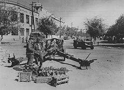 Wehrmacht soldiers operating 10.5 cm leFH 18. Svobody Street, 1942