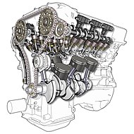 Neben zwei Steuerketten (oben halbverdeckt an den Nockenwellen) treibt ein Zahnriemen (anstelle der Steuerkette hier im Bildvordergrund) den Mu-V6-Motor an.