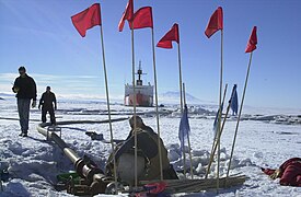 A United States Polar Class icebreaker offloading fuel at Marble Point