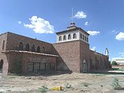 The historic "El Cid Castle" was a bowling alley that resembled a Moorish Castle. It was built by the late Dr. Kenneth Hall, a physician who served the Community of Sunnyslope in Phoenix. Construction on the structure began in 1963 and was completed in 1980. It is located at the Northwest corner of 19th Ave and West Cholla Drive, which technically is on the opposite side Sunnyslope's western boundary.[63]