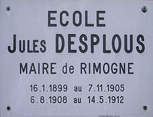 Photographie de la plaque indiquant le nom de l'école