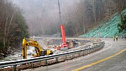 Repair of Route 2 after a 6-mile washout along the Cold River caused by Hurricane Irene.