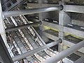 Image 38Escalators at Westminster Underground station descend between beams and columns of the station box to reach the deep-level Jubilee line platforms.