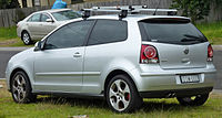 Rear-three-quarter view of a car fitted with a roof rack