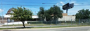 A two-story, low-slung, 1960s office building