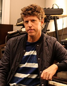Greg Kurstin in a striped t-shirt and jacket