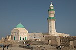 Mosque and minaret with green roofs