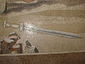 Detail of a fallen sword from the bottom right of the Mosaic (showing the individual tesserae).