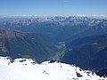 Il rifugio visto dalla cima del Vioz. Sullo sfondo la Val di Peio.