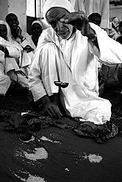 A merchant weighs pearls in Qatif, 1970s.
