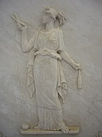 Atropos cutting the thread of life. Modern Greek low relief