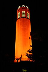 Coit Tower at night, lit orange in recognition of the San Francisco Giants