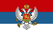 The flag of Montenegro (1905–1918), a defaced Serbian flag with the coat of arms of Montenegro