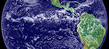 Satellite image of a loosely contiguous band of clouds straddling the equator