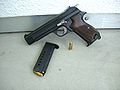 A late Swiss army model SIG P210-2 (issued in the early 1970s), stamped "P" for private ownership, with replaced grip plates.