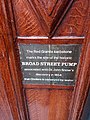 An image showing the plaque marking the significance of the red granite and the pump. Located on the wall of the John Snow pub, straight across from the pump itself.