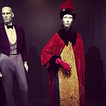 Shot of a FIDM Museum costume exhibit, highlighted by Gustave's signature uniform and Madame D's ornate coat-and-gown ensemble