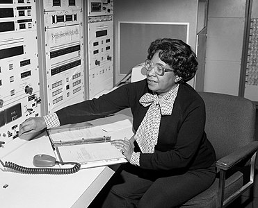Mary Jackson at a control panel, by the Langley Research Center (restored by Adam Cuerden)