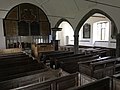 The interior of St Petrock's from the back of the nave