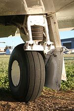 Rubber discs in compression with trailing link of a Mooney M20