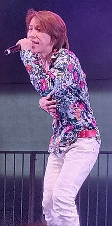 Takayoshi Tanimoto performing at Anime Summit 2023 in Brasília, Brazil