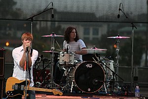 Cartel performing in 2008 with their original lineup (shown are Kevin Sanders on drums and Will Pugh on vocals)