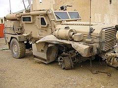 Cougar hit by a mine explosion, all crew survived, the vehicle was driven back to base on 3 wheels