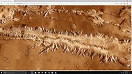 Wide view of part of Ius Chasma with the Louros Valles along its southern margin.