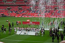 Swansea City celebrating on the Wembley pitch
