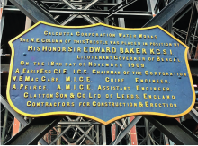 badge shaped plaque with details of foundation of the tank