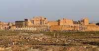 Ruins of stone buildigns with columns.