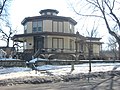 Severely plain house, limestone walls finished with cement render. Features are typical of Fowler's influence: all-round veranda, flat roof and central lantern. Norrish House, Hastings, Minnesota (built between 1857 and 1858).