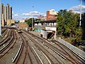 Concourse Yard revealing a tunnel where D and B trains enter the yard. Tracey Towers is in the background.