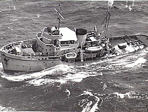 An aerial photograph of the tugboat HMAS Reserve at sea