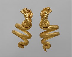 A pair of gold armbands, with a triton and tritoness respectively.