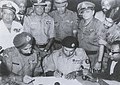Image 44Pakistan Army General A. A. K. Niazi signing surrender agreement before Sh. Jagjit Singh Aurora of Indian Army after getting defeated in the 1971 Bangladesh Liberation War against East Pakistan, which eventually liberated as Bangladesh later. (from 1970s)