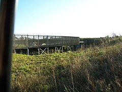 Reconstitution du rempart nord, panneau en bois a clin.