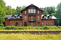 Station building: offices in the central section of the building, living accommodation above. West wing (right) for VIPs, waiting room in the east wing.