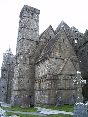 Cormac's Chapel, Rock of Cashel, Ireland, with its steeply pitched roof and bands of blind arcading maintains a distinctly Irish character.