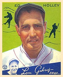 A baseball card image of a man in a white baseball uniform with red trim and a black newsboy hat