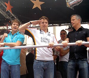 John Barrowman (center) and partner Scott Gill (left)