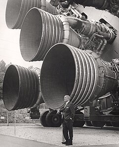 Wernher von Braun with the Rocketdyne F-1 engines, by NASA