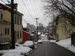 Row houses on hilly Itin Street afford a powerful view of the skyline.